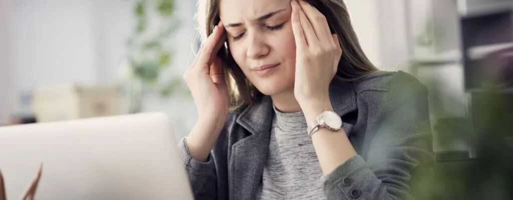 a woman suffering from Headaches